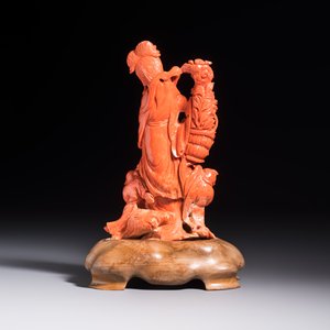 A Chinese carved red coral 'Goddess and Boys' group on a wooden stand, 19/20th C. — photo 3