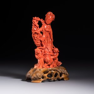 A Chinese carved red coral 'Goddess and Boys' group on a wooden stand, 19/20th C. — photo 5