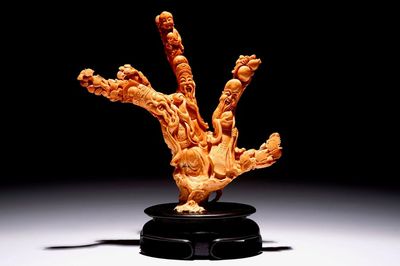 A Chinese carved red coral group of immortals, 19/20th C.