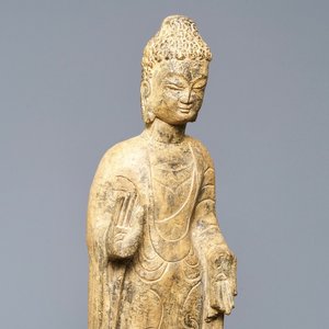 A Chinese carved stone figure of a standing Buddha, Ming or later — photo 1