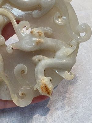 A Chinese carved white and russet jade bi-disc with chilong design, 19/20th C. — photo 3