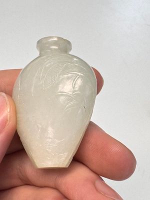 A Chinese carved white jade 'Geese' snuff bottle on a wooden stand — photo 12