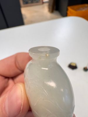 A Chinese carved white jade 'Geese' snuff bottle on a wooden stand — photo 14