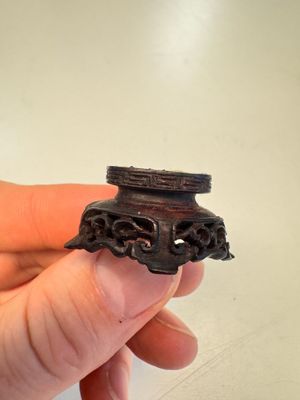 A Chinese carved white jade 'Geese' snuff bottle on a wooden stand — photo 18