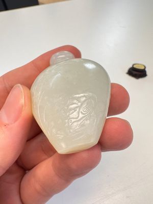 A Chinese carved white jade 'Geese' snuff bottle on a wooden stand — photo 5