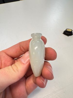 A Chinese carved white jade 'Geese' snuff bottle on a wooden stand — photo 6