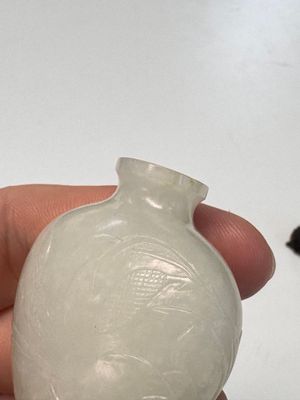 A Chinese carved white jade 'Geese' snuff bottle on a wooden stand — photo 8