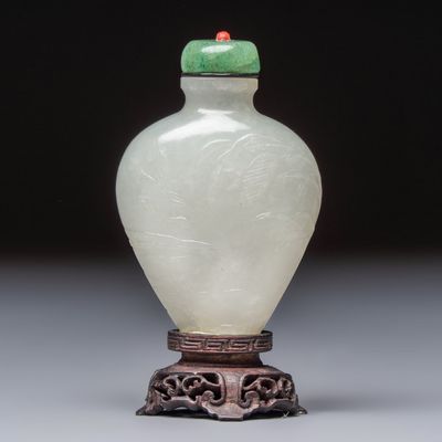 A Chinese carved white jade 'Geese' snuff bottle on a wooden stand, 18/19th C.