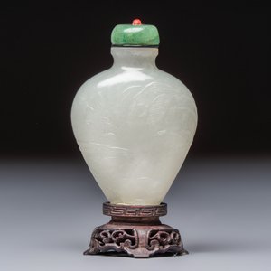 A Chinese carved white jade 'Geese' snuff bottle on a wooden stand — photo 1