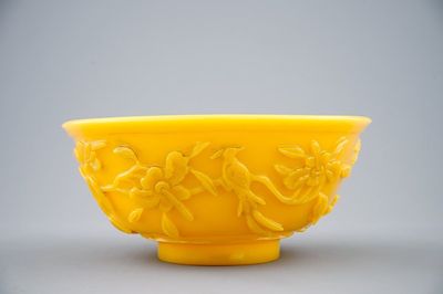 A Chinese carved yellow Beijing glass bowl, 19th C.