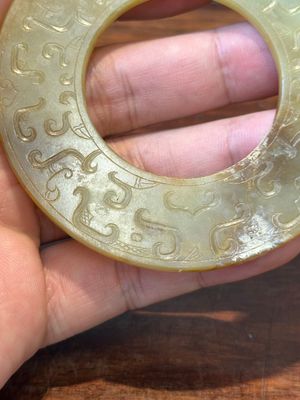 A Chinese celadon and russet jade 'bi' disc, probably Han — photo 4