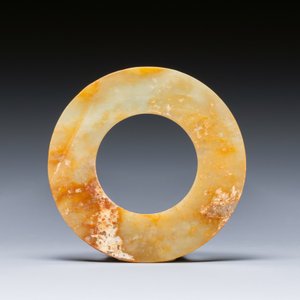 A Chinese celadon and russet jade 'bi' disc, probably Han — photo 2