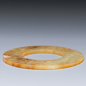 A Chinese celadon and russet jade 'bi' disc, probably Han — photo 3