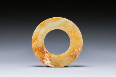 A Chinese celadon and russet jade 'bi' disc, probably Han — photo 2