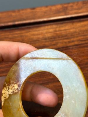 A Chinese celadon and russet jade 'bi' disc, probably Han — photo 7