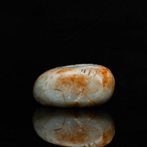 A Chinese celadon and russet jade boulder carving, Qing — photo 7