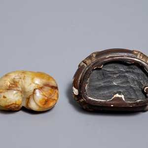 A Chinese celadon and russet jade carving of a tiger, Ming — photo 13