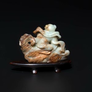A Chinese celadon and russet jade figure of a boy riding a dragon carp, Qing — photo 4