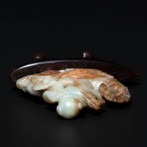 A Chinese celadon and russet jade figure of a boy riding a dragon carp, Qing — photo 6