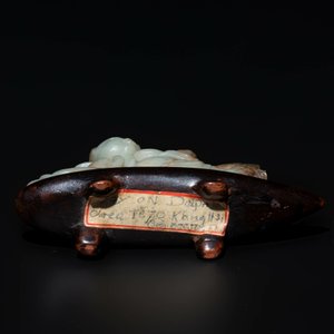 A Chinese celadon and russet jade figure of a boy riding a dragon carp, Qing — photo 7