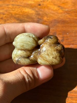 A Chinese celadon and russet jade mythical beast carving, Ming — photo 1