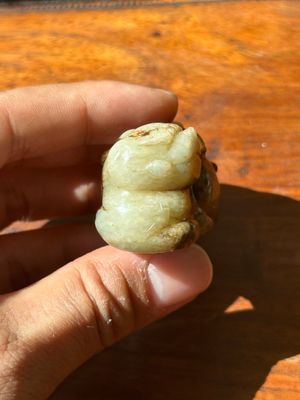 A Chinese celadon and russet jade mythical beast carving, Ming — photo 2