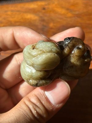A Chinese celadon and russet jade mythical beast carving, Ming — photo 7