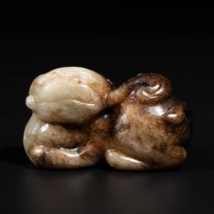 A Chinese celadon and russet jade mythical beast carving, Ming — photo 1