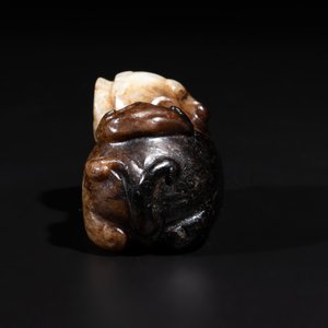 A Chinese celadon and russet jade mythical beast carving, Ming — photo 2