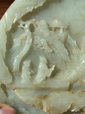 A Chinese celadon and russet jade plaque with landscape design, 19th C. — photo 11