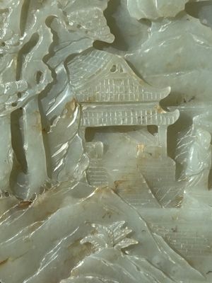 A Chinese celadon and russet jade plaque with landscape design, 19th C. — photo 3