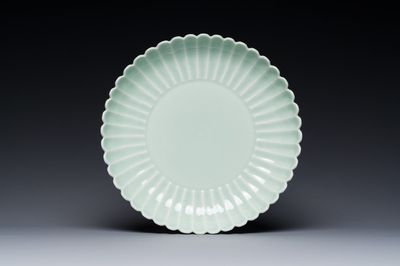 A Chinese celadon-glazed chrysanthemum-shaped plate, Qianlong mark, 20th C.