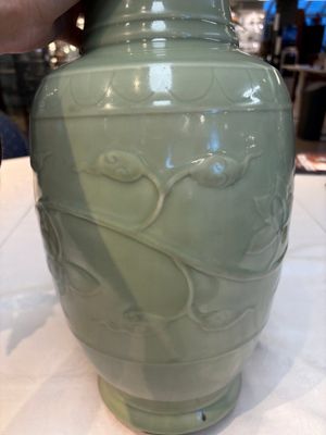 A Chinese celadon-glazed vase with relief lotus scroll design, 18th C. — photo 11