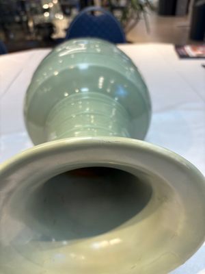 A Chinese celadon-glazed vase with relief lotus scroll design, 18th C. — photo 8