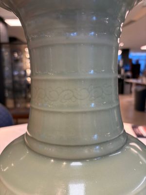 A Chinese celadon-glazed vase with relief lotus scroll design, 18th C. — photo 10