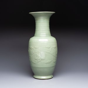 A Chinese celadon-glazed vase with relief lotus scroll design, 18th C. — photo 3