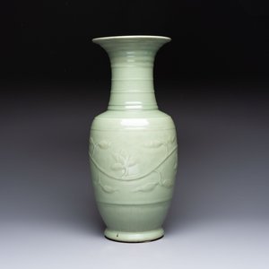 A Chinese celadon-glazed vase with relief lotus scroll design, 18th C. — photo 4