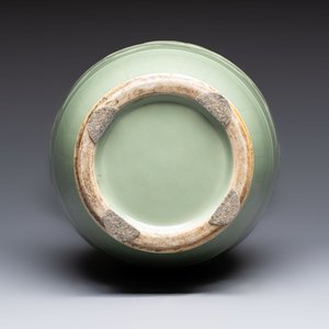 A Chinese celadon-glazed vase with relief lotus scroll design, 18th C. — photo 7