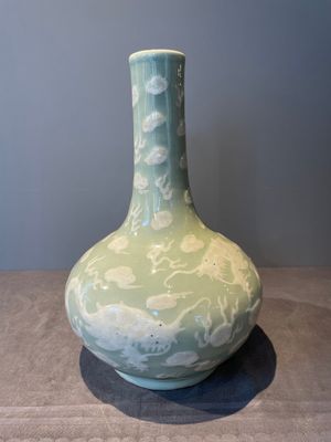 A Chinese celadon-ground slib design 'dragon' vase and Chinese blue and white vase or incense container, 19th C. — 照片 1