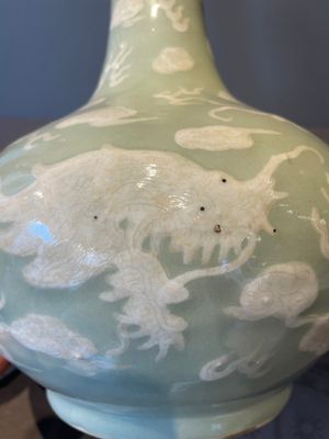 A Chinese celadon-ground slib design 'dragon' vase and Chinese blue and white vase or incense container, 19th C. — 照片 10