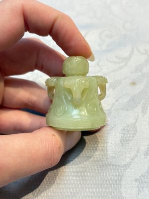 A Chinese celadon jade covered vase, with wooden stand, and a bowl with wooden cover and stand, 19/20th C. — photo 14