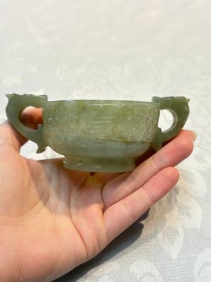 A Chinese celadon jade covered vase, with wooden stand, and a bowl with wooden cover and stand, 19/20th C. — photo 24