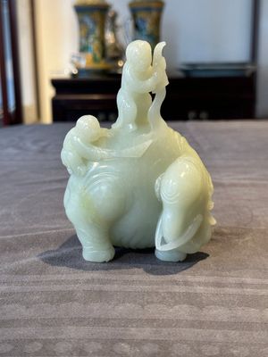 A Chinese celadon jade group of two boys cleansing an elephant, 18th C. — photo 1