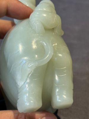 A Chinese celadon jade group of two boys cleansing an elephant, 18th C. — photo 11