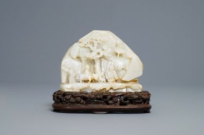 A Chinese celadon jade 'mountain landscape' boulder, 19/20th C.