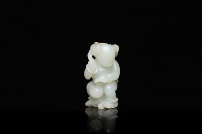 A Chinese celadon jade sculpture of a boy with a cat, Qing