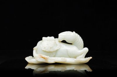 A Chinese celadon jade sculpture of a mythical horse, 18th C.