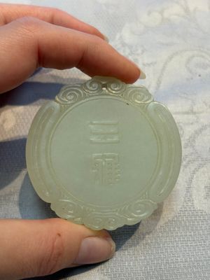 A Chinese celadon jade snuff bottle, a plaque and a ritual stick, Han and later — photo 1