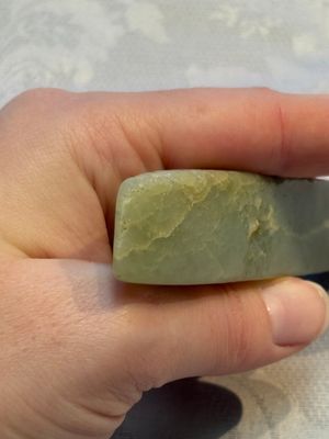 A Chinese celadon jade snuff bottle, a plaque and a ritual stick, Han and later — photo 11