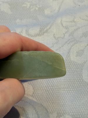 A Chinese celadon jade snuff bottle, a plaque and a ritual stick, Han and later — photo 12